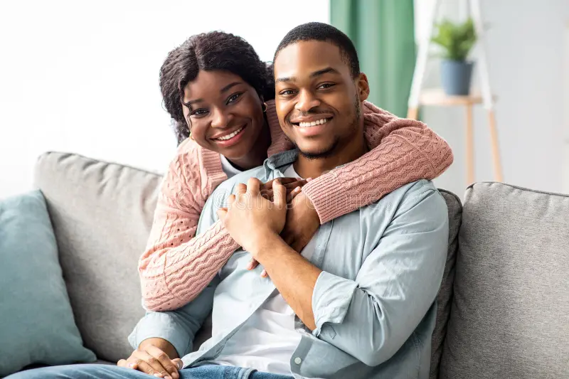 A smiling couple sitting together